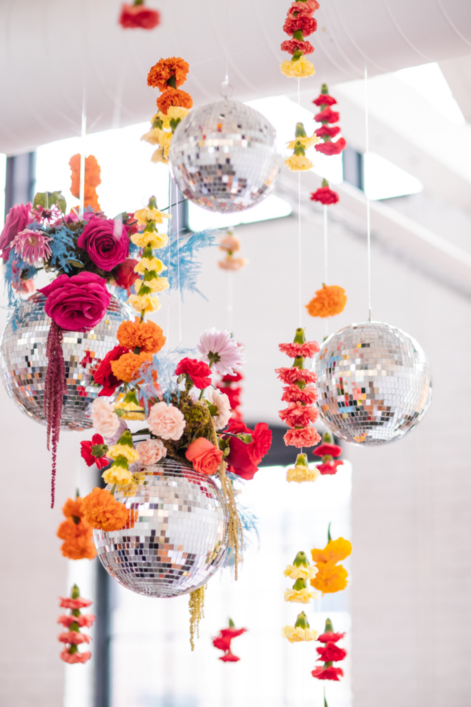 Disco balls and hanging floral arrangements
